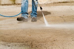 Pressure washing Company - a concrete sidewalk being pressure washed